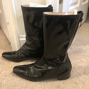 Manolo Blahnik midcalf boots in glossy black patent leather